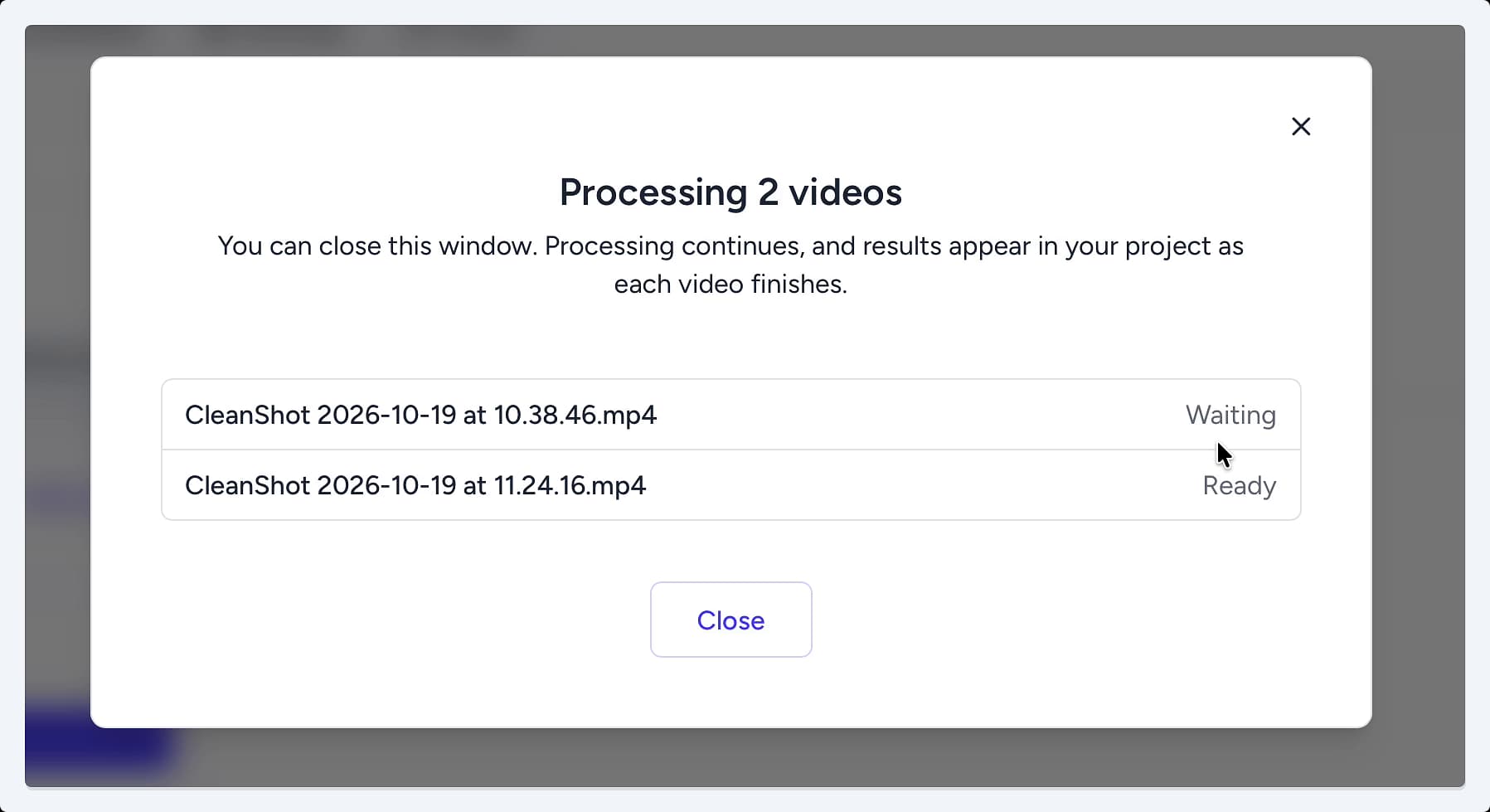 The Processing 2 videos modal showing the status for each file, with one marked as 'Waiting' and the other as 'Ready'. The Processing 2 videos modal showing the status for each file, with one marked as 'Waiting' and the other as 'Ready'.